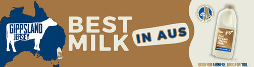 Gippsland Jersey milk advertisement with a map of Australia, text 'Best Milk in Aus', and a bottle of milk on a brown background.